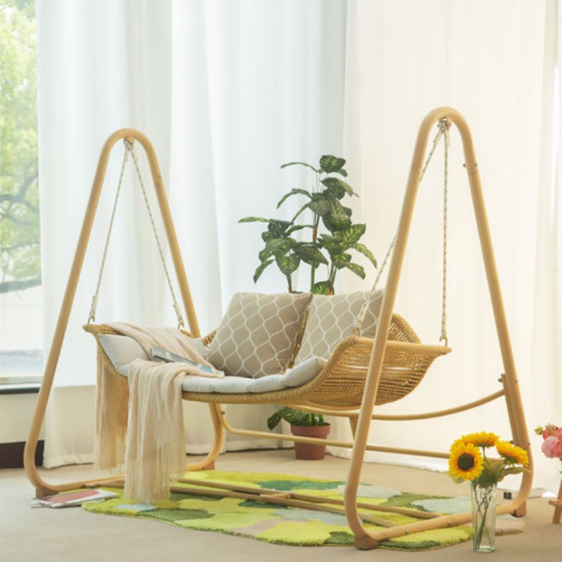Nordic aluminum swing chair showcasing plush cushion from the side.