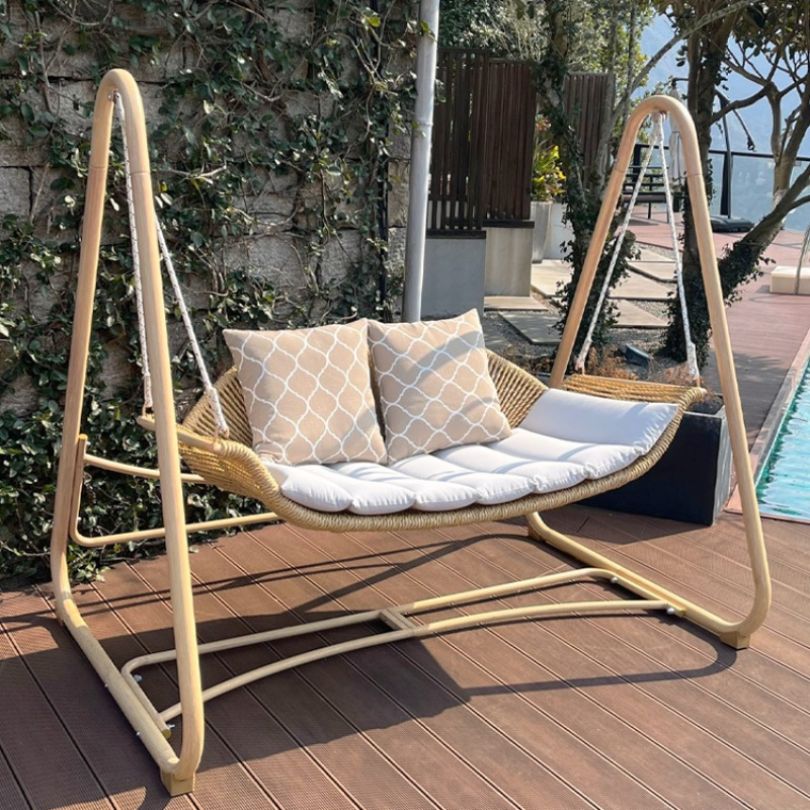 Nordic aluminum swing chair showcasing plush cushion from the side.