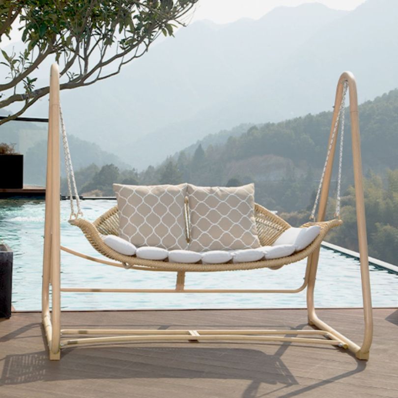 Comfortable cushioned swing seat perfect for patio lounging.