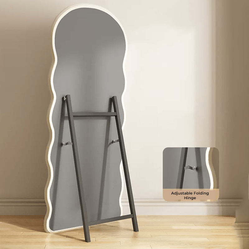 Curvy black full length mirror showcasing its unique wave shape in a stylish bedroom setting.