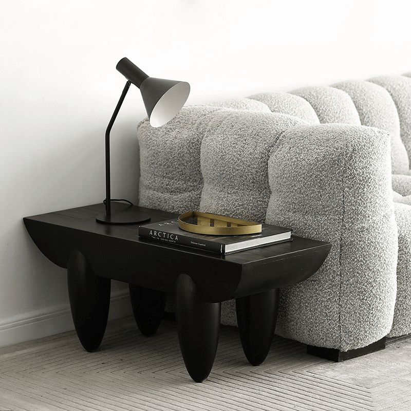 Side view of Nordic Elegance Black Steel Coffee Table showcasing its handcrafted wooden top and black steel frame.