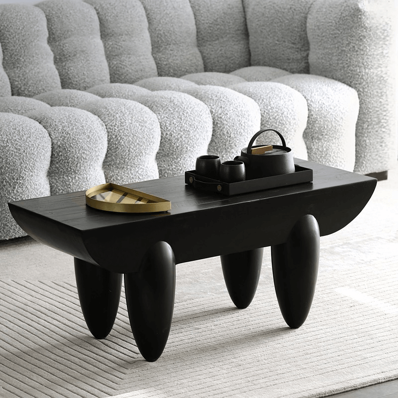 Side view of Nordic Elegance Black Steel Coffee Table showcasing its handcrafted wooden top and black steel frame.