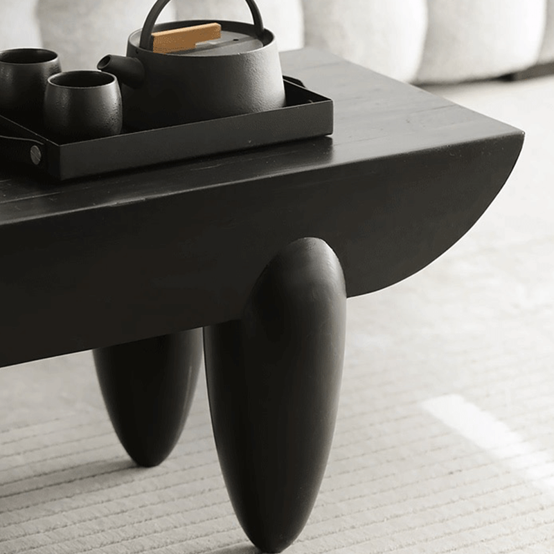 Side view of Nordic Elegance Black Steel Coffee Table showcasing its handcrafted wooden top and black steel frame.