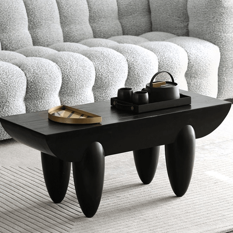 Nordic Black Steel Coffee Table in a modern living room setup, styled with decorative items.