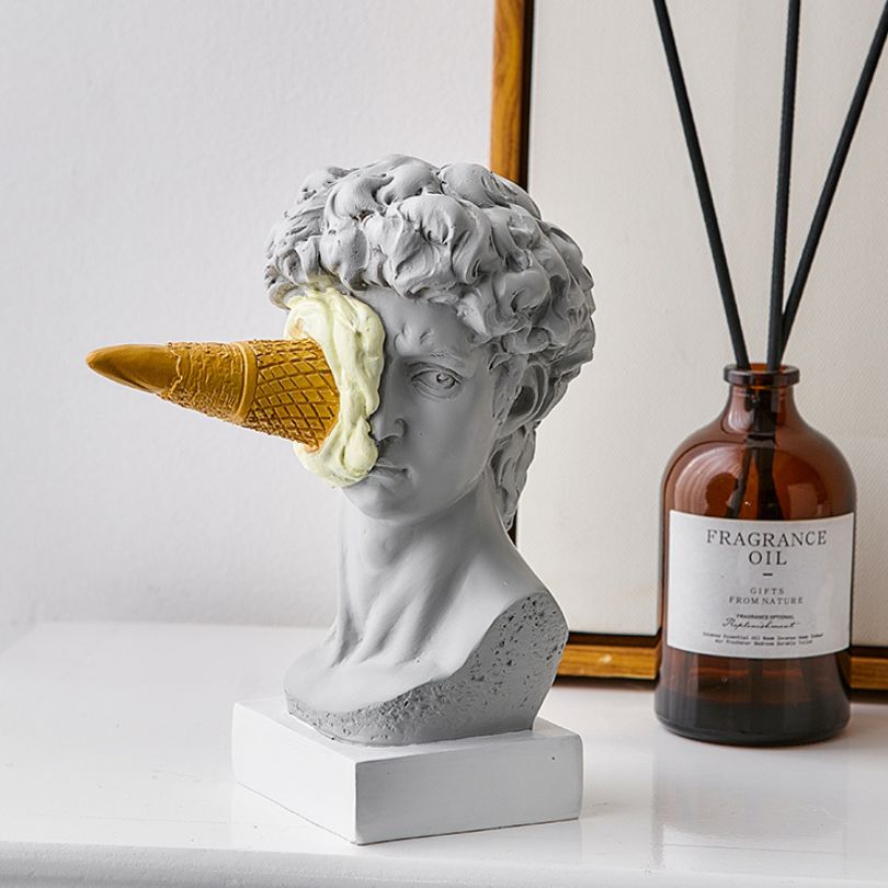 Side view of Nordic David sculpture with ice cream, emphasizing its unique artistic design.