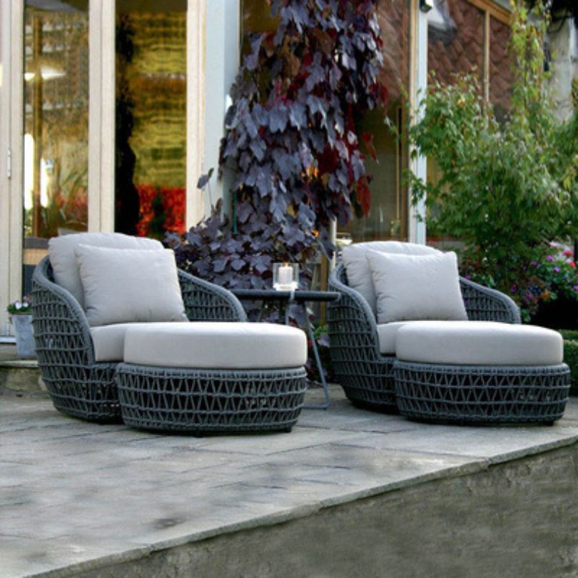 Side view of the Nordic curved patio sofa showcasing its elegant design and plush cushions.