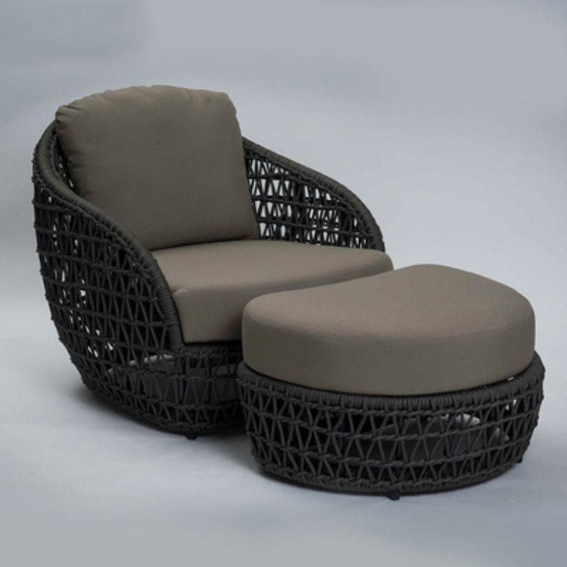 Close-up of the woven rope texture on the curved sofa, highlighting the quality craftsmanship.