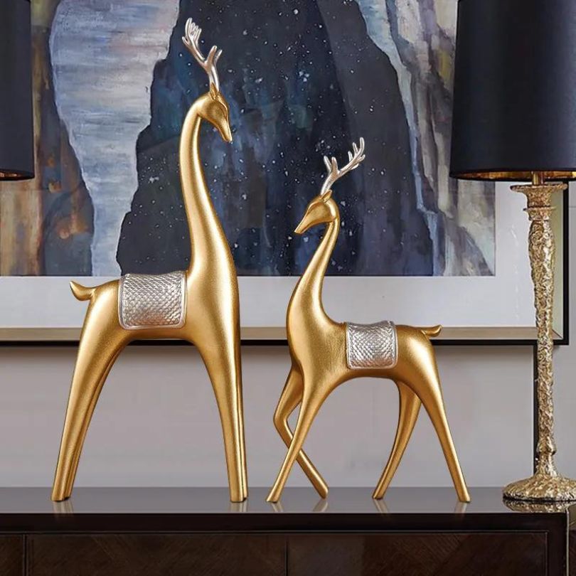 Elegant Nordic couple deer resin sculpture showcasing its irregular shape and beautiful black and gold design.