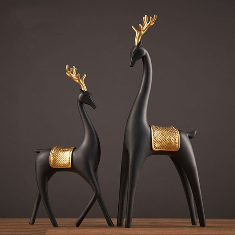 Elegant Nordic couple deer resin sculpture showcasing its irregular shape and beautiful black and gold design.