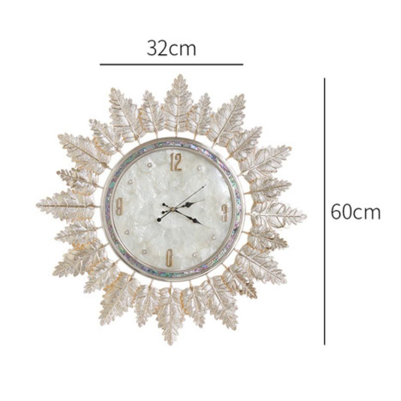 Elegant Nordic Glass Leaf Wall Clock displayed in a modern living room setting.