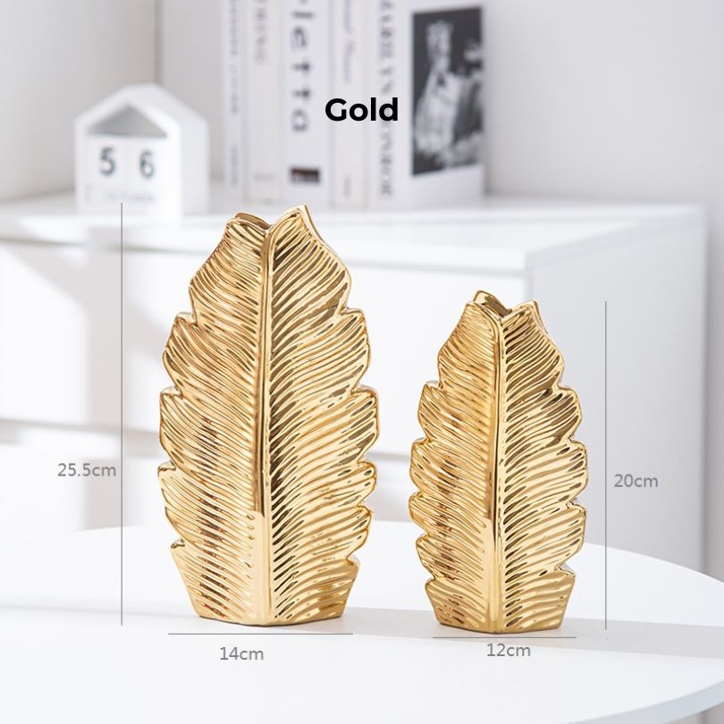 Elegant Nordic gold pleated leaf ceramic vase set displayed on a modern dining table.