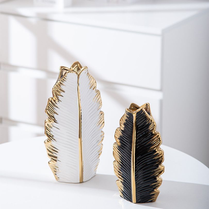 Close-up of the pleated leaf design on the Nordic gold ceramic vase, showcasing its intricate details.