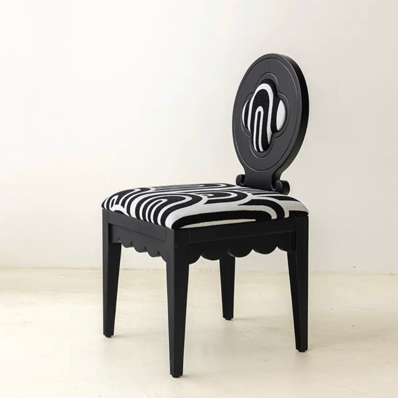 Nordic Hollow Clovers chair with cushion in white, showcased in a bright dining room.