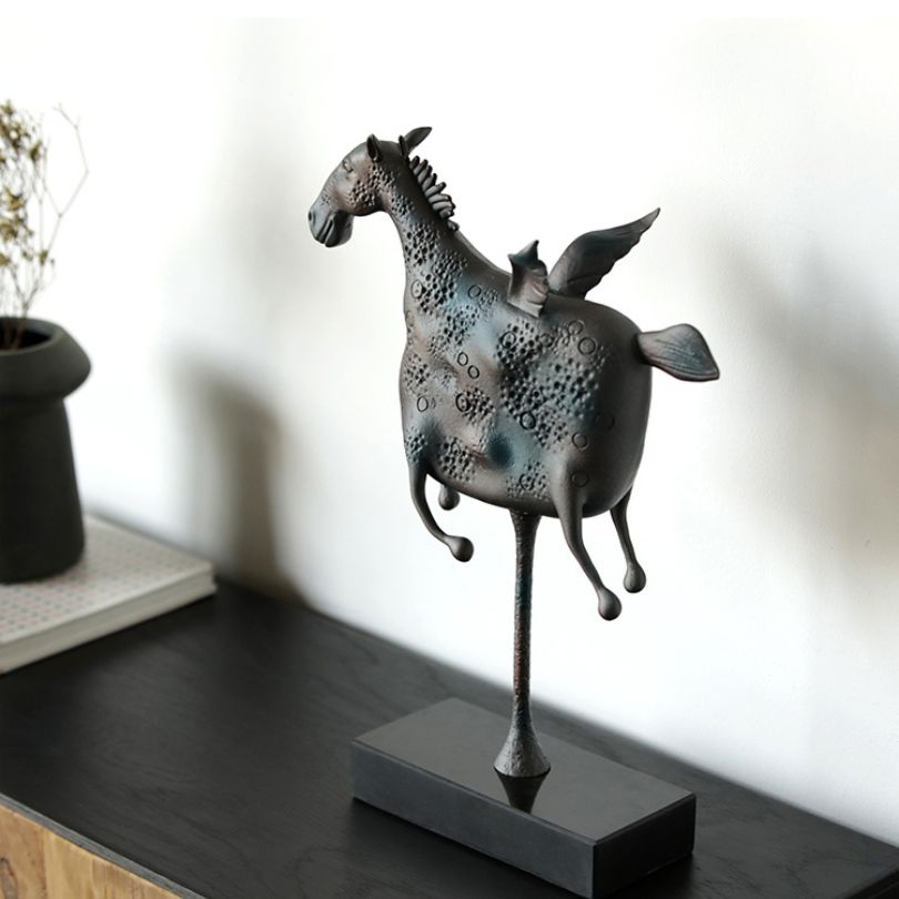 Side angle of the handcrafted Pegasus sculpture showcasing its unique marble craftsmanship.