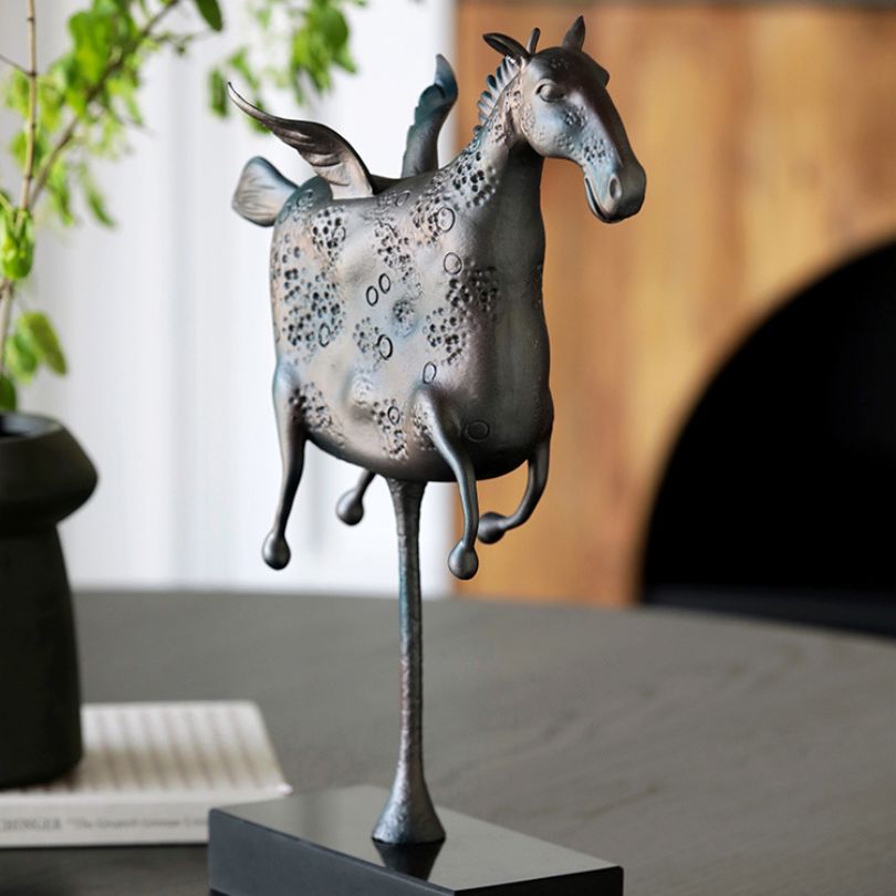 The Pegasus statue displayed in a modern living room, enhancing the decor.