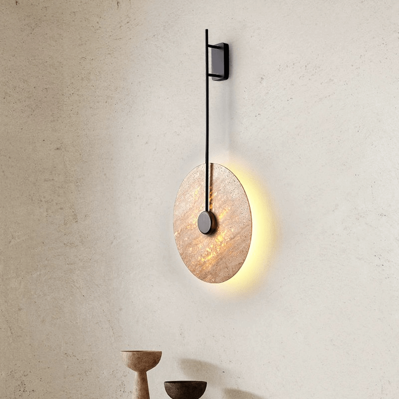 Close-up of the Nordic marble LED wall lamp showcasing its elegant design and warm light in a living room.