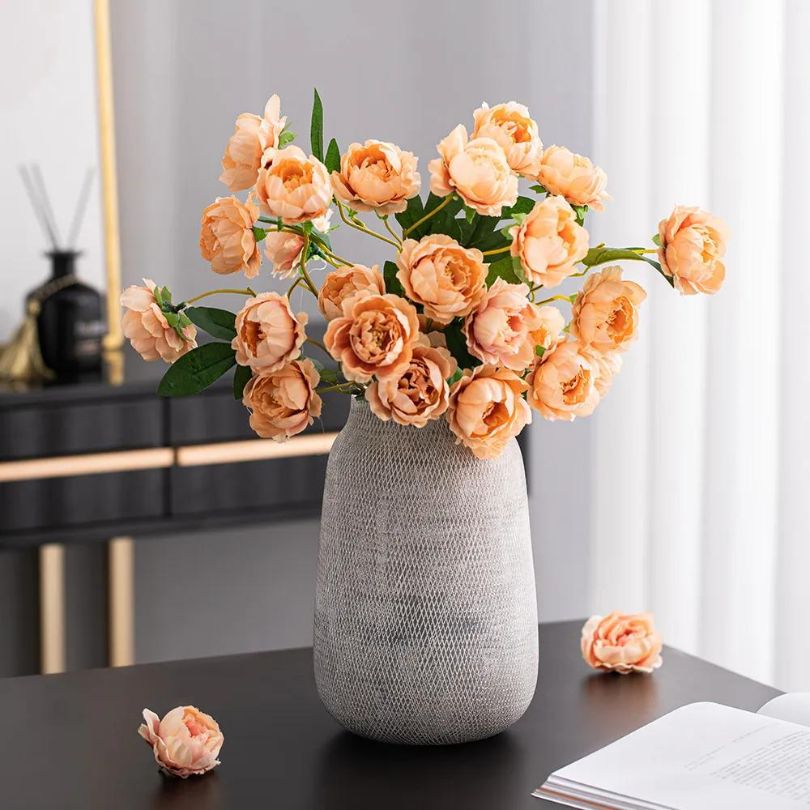 Nordic Elegance Ceramic Mesh Flower Vase in grey, showcasing its delicate mesh design from a front angle.