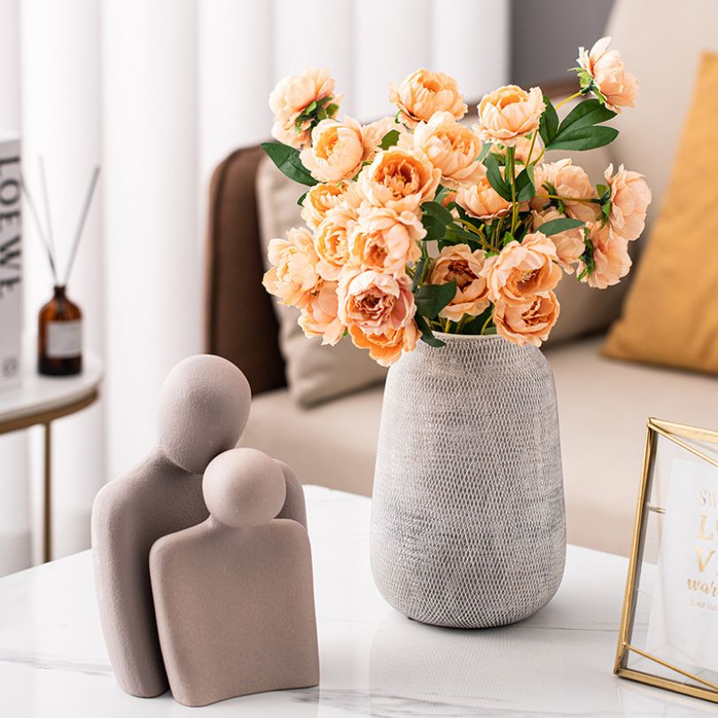 Nordic Elegance Ceramic Mesh Flower Vase in grey, showcasing its delicate mesh design from a front angle.