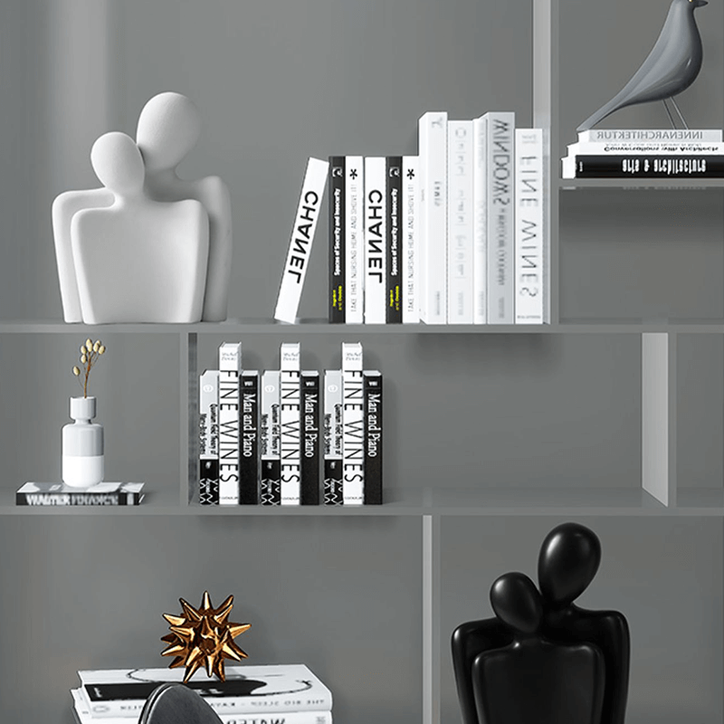 Nordic Embrace Couple Ceramic Sculpture placed on a shelf, enhancing home decor.