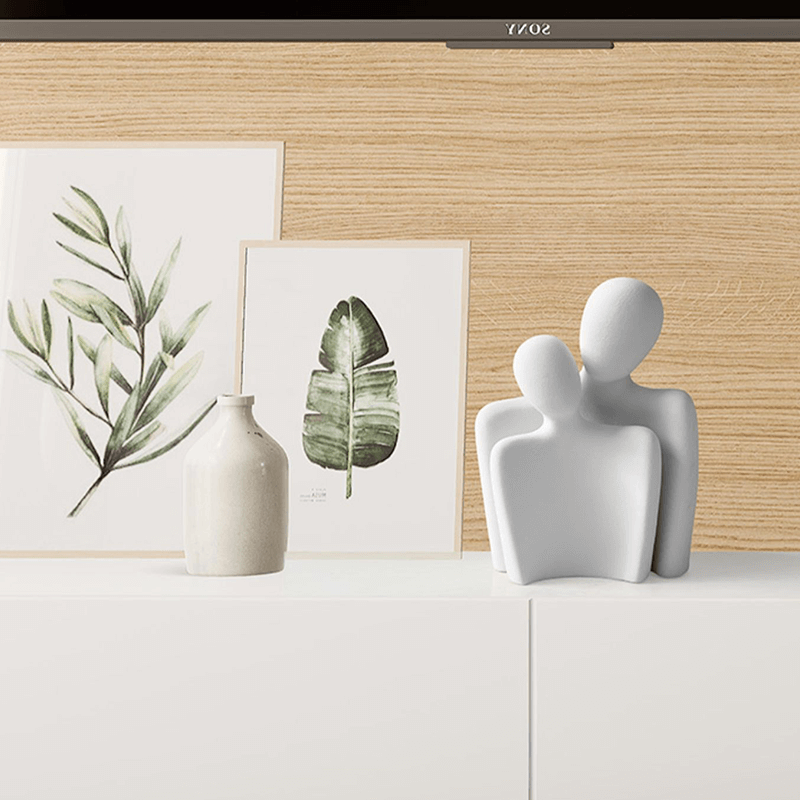 Close-up view of the Nordic Couple Sculpture showcasing its elegant design and finish.