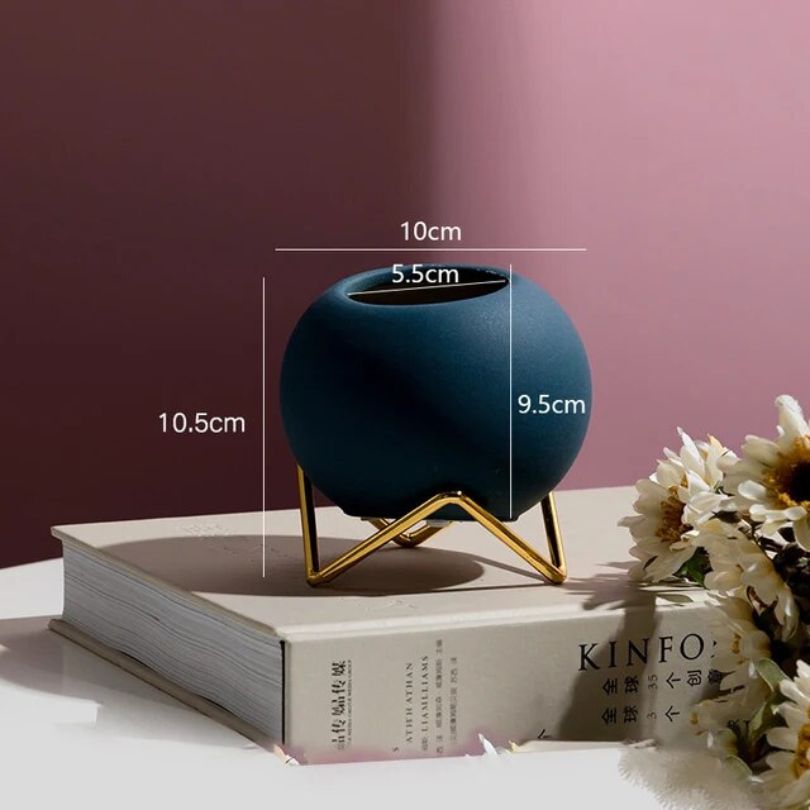 Nordic round pottery floral vase in royal blue with metal stand, perfect for home decor.