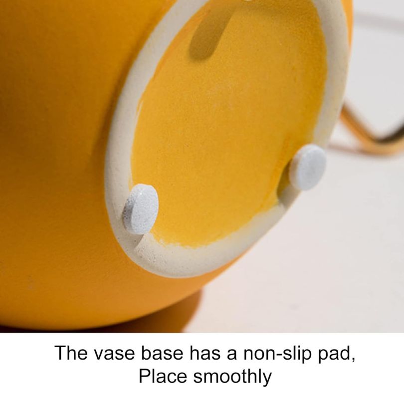 Close-up of matte yellow Nordic vase highlighting its elegant design and ceramic texture.