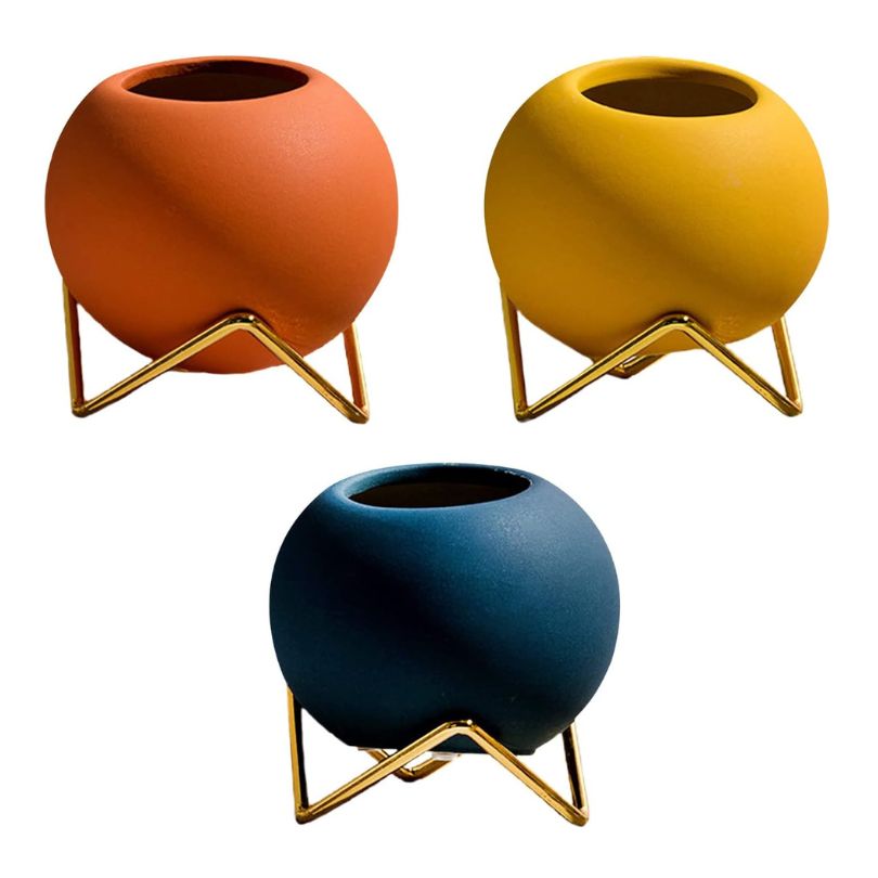 Close-up of matte yellow Nordic vase highlighting its elegant design and ceramic texture.