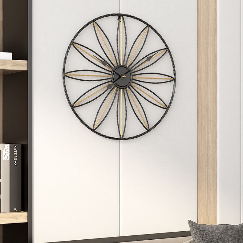 Close-up view of the decorative wall clock with silent movement highlighting its modern gold finish.