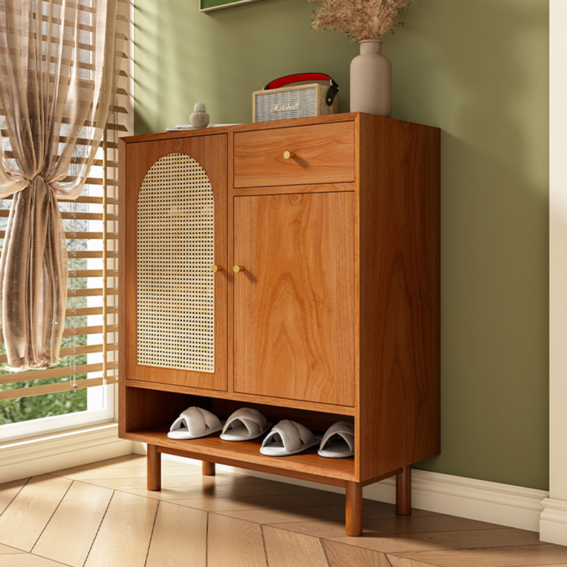 Side angle of the wooden shoe cabinet featuring rattan design and ample storage space.
