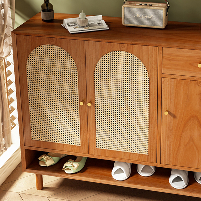 Front view of the Nordic rattan shoe cabinet with shelves and drawers.