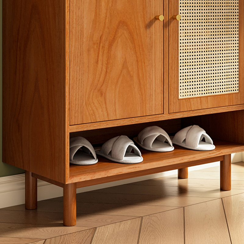 Side angle of the wooden shoe cabinet featuring rattan design and ample storage space.