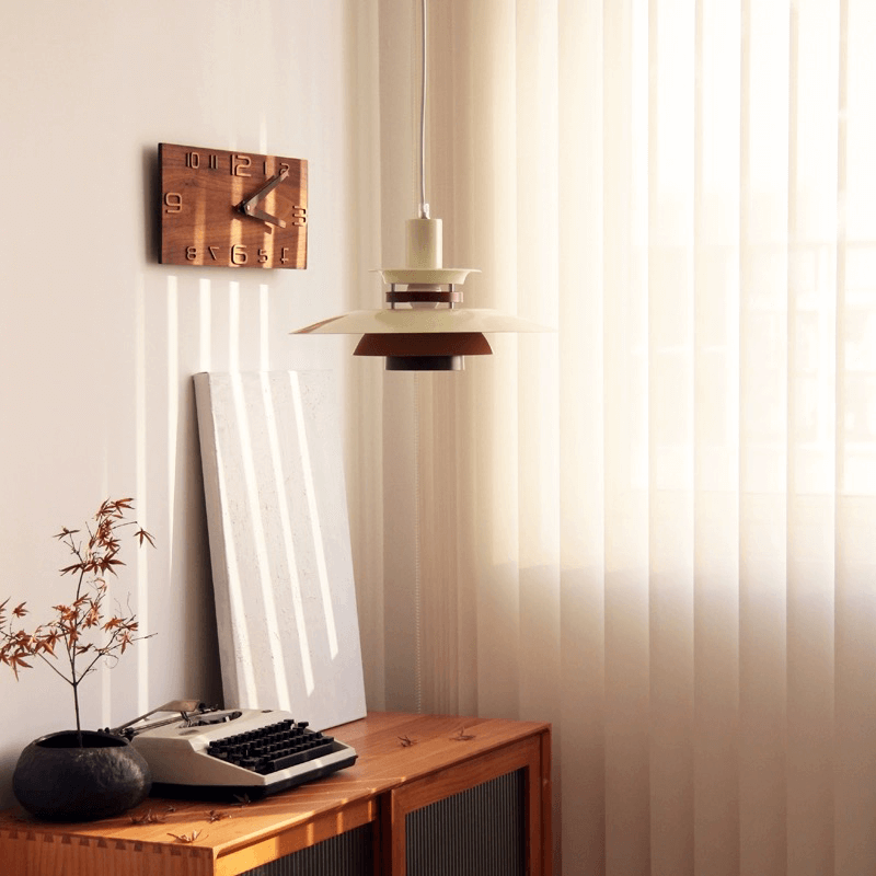 Elegant Nordic PH5 Pendant Lamp hanging in a cozy cafe, showcasing its stylish aluminum and wood design.