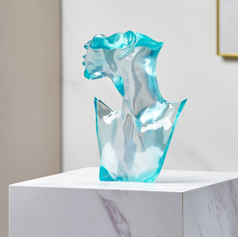 Nordic transparent art statue showcasing its luminous design and modern aesthetic from a side angle.
