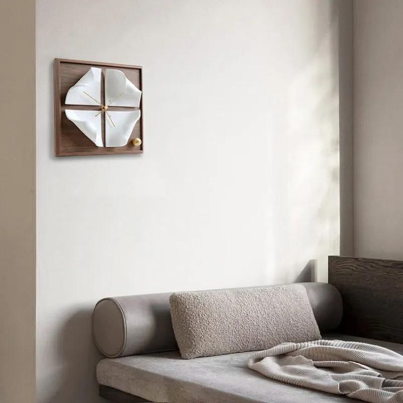 Front view of the stylish Nordic walnut wood desk clock on a modern office desk.