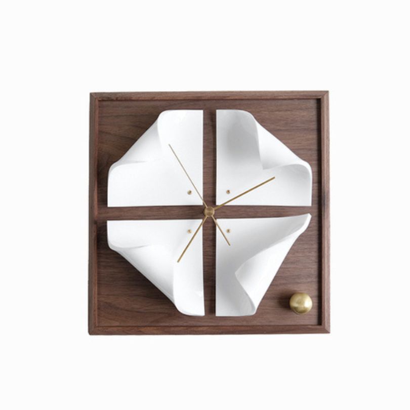 Close-up of the minimalist design of the walnut wood clock, highlighting its sleek finish.