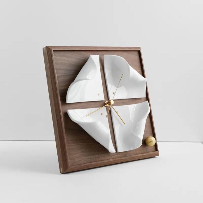 Front view of the stylish Nordic walnut wood desk clock on a modern office desk.