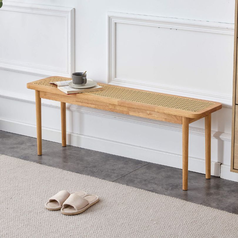 Close-up of the woven rattan texture on the Nordic dining bench