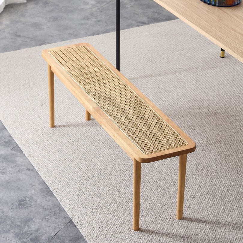 Side view showcasing the natural finish and solid wood base of the bench
