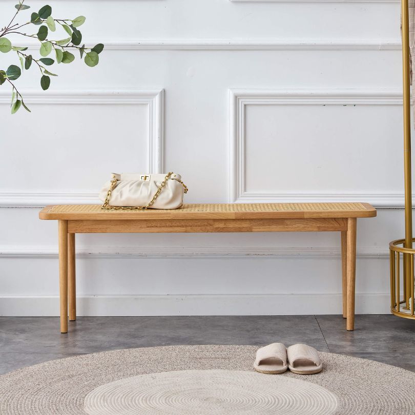 Close-up of the woven rattan texture on the Nordic dining bench