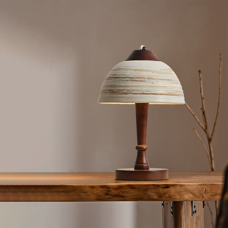 Close-up of the ceramic lampshade of the best modern wooden table lamp, highlighting its craftsmanship.