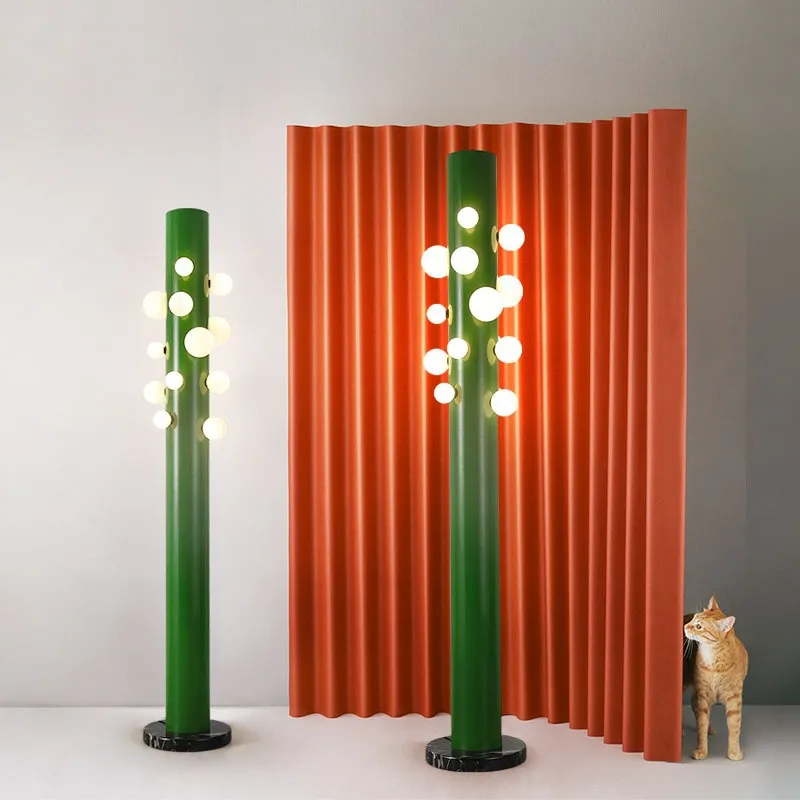 Modern lighting ambiance created by the green glass floor lamp in a spacious foyer.