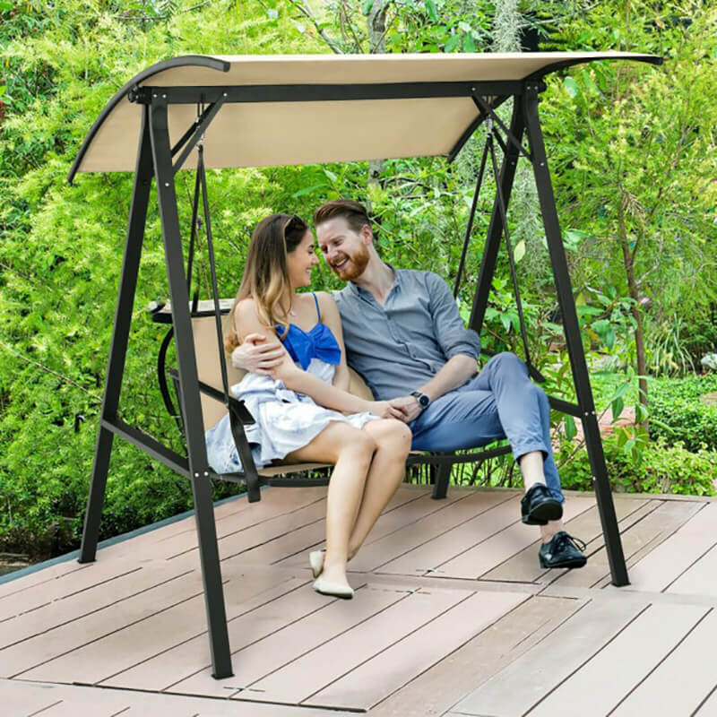Adjustable canopy hammock set up in a sunny patio, showcasing its waterproof fabric.