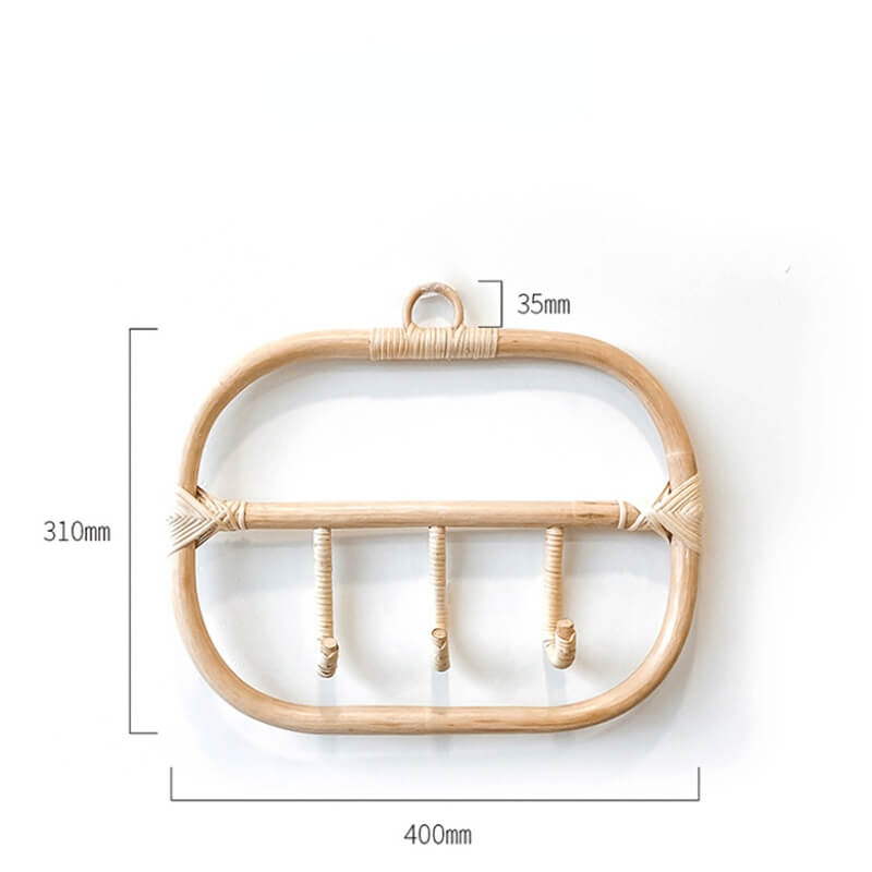 Rattan coat hanger in a cozy entryway, displaying coats and bags elegantly.