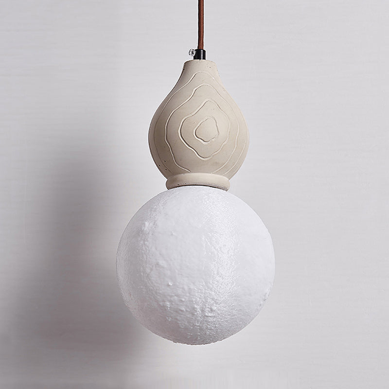 Artistic Antique Pendant Light from a side angle, highlighting the unique sphere design.