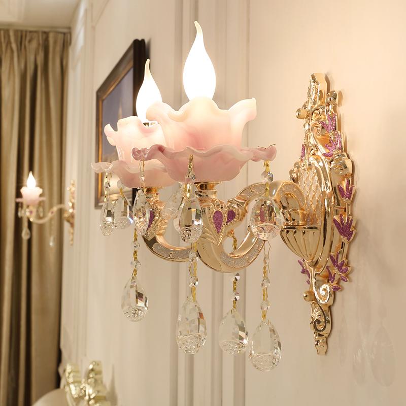 Elegant crystal wall sconce showcasing its gorgeous purple hue and unique design.