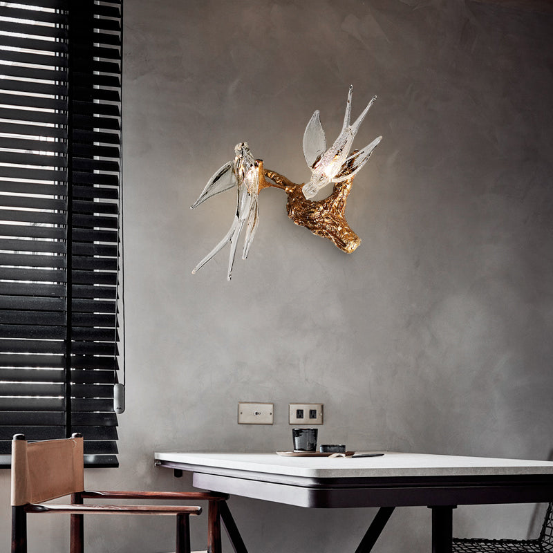 Copper Swallow LED Wall Sconce showcasing a luxurious glow in a living room setting.