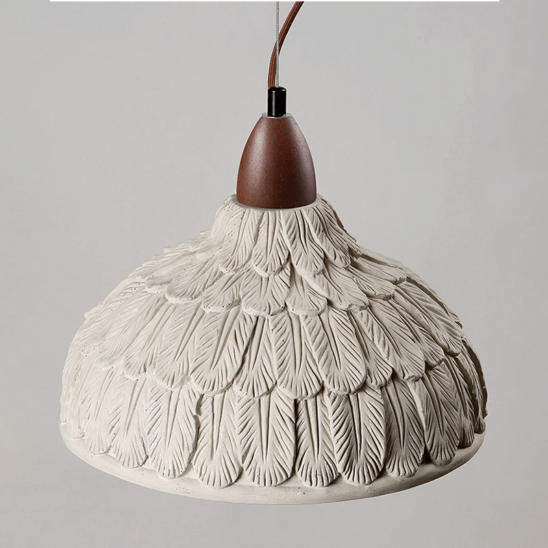 Adjustable rustic ceiling light illuminating a stylish dining area.