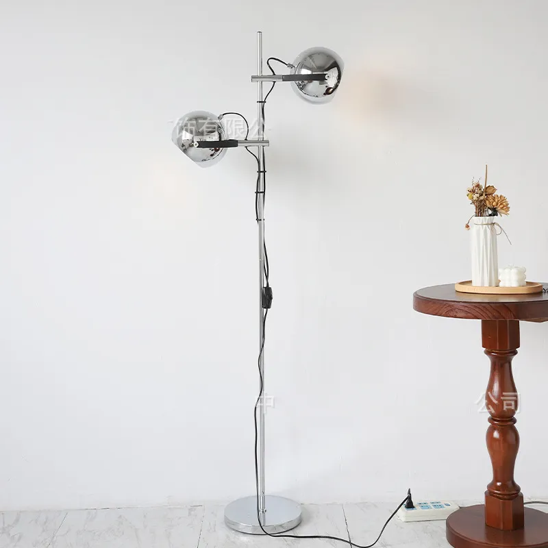 Side view of the Modern Chrome Bauhaus LED Floor Lamp in a cozy living room setting.