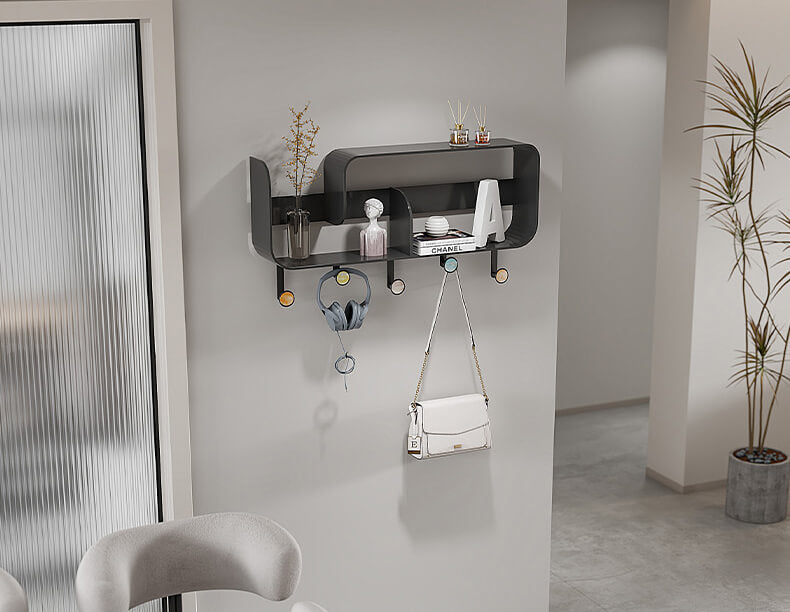 Close-up of black metal punch-free coat hooks and shelf for modern entryway storage
