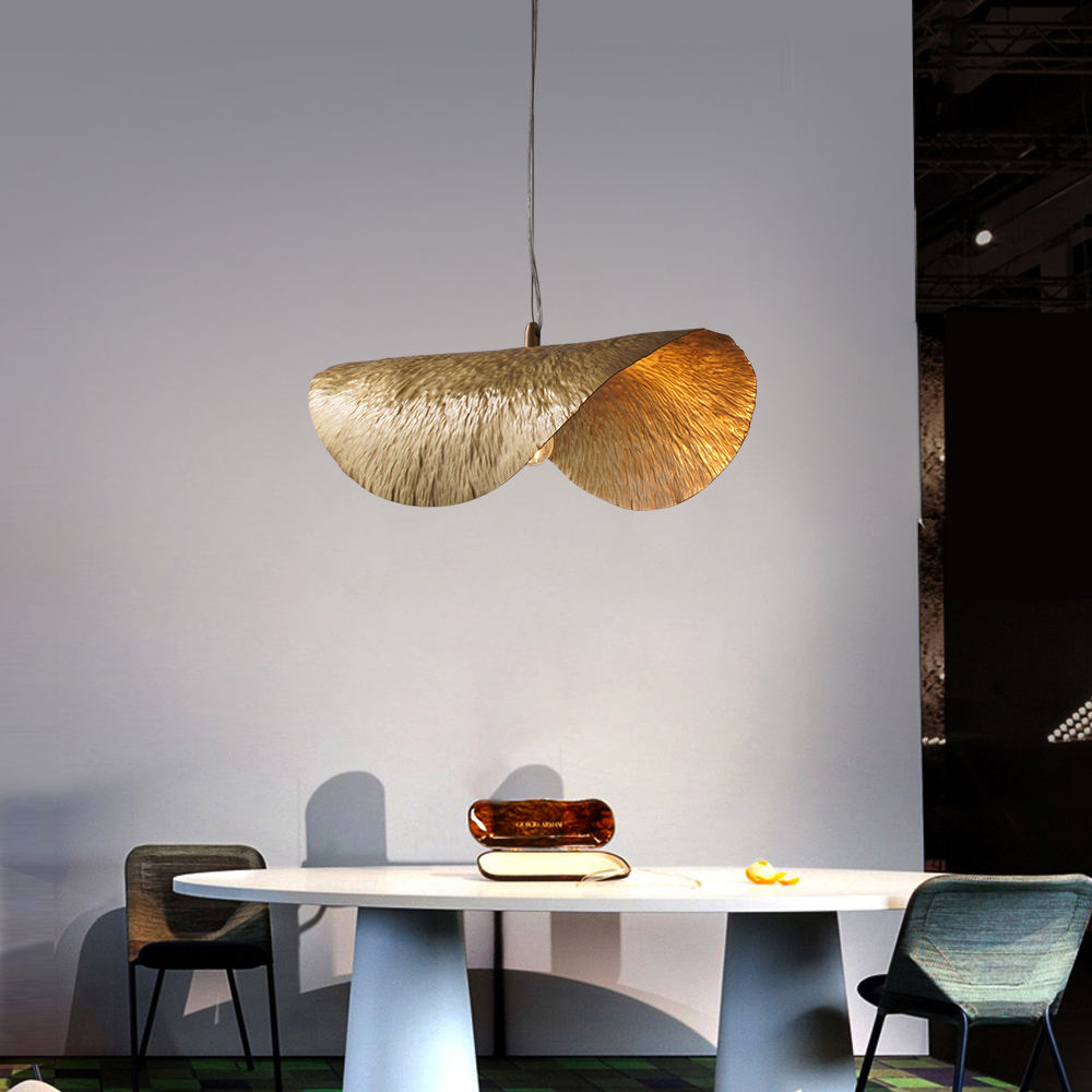 Stylish copper light hanging in a cozy living room, adding warmth and elegance to the decor.